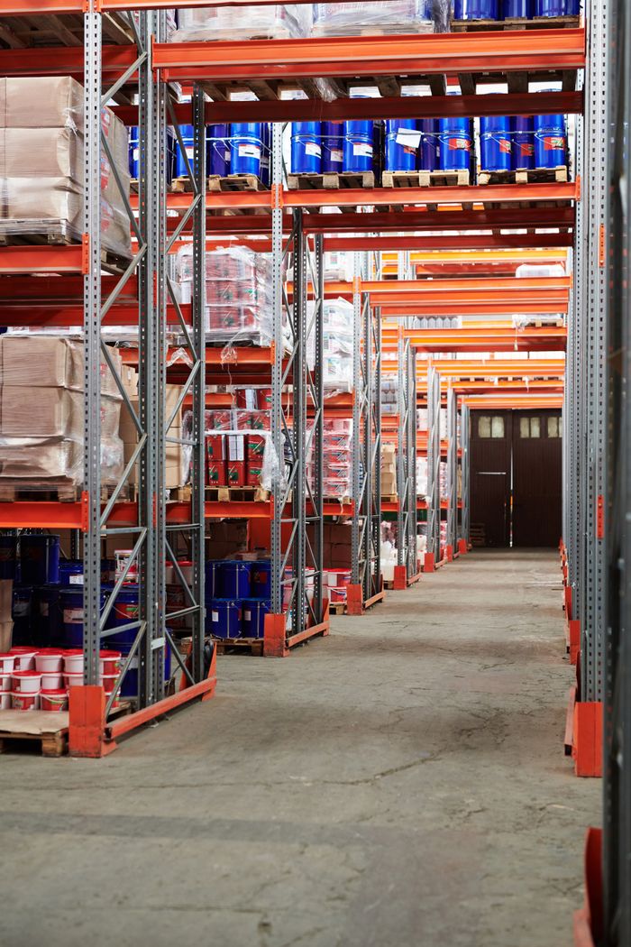 Crafting Captivating Headlines: Your awesome post title goes here Industrial warehouse interior with organized shelves stacked with packages and goods.